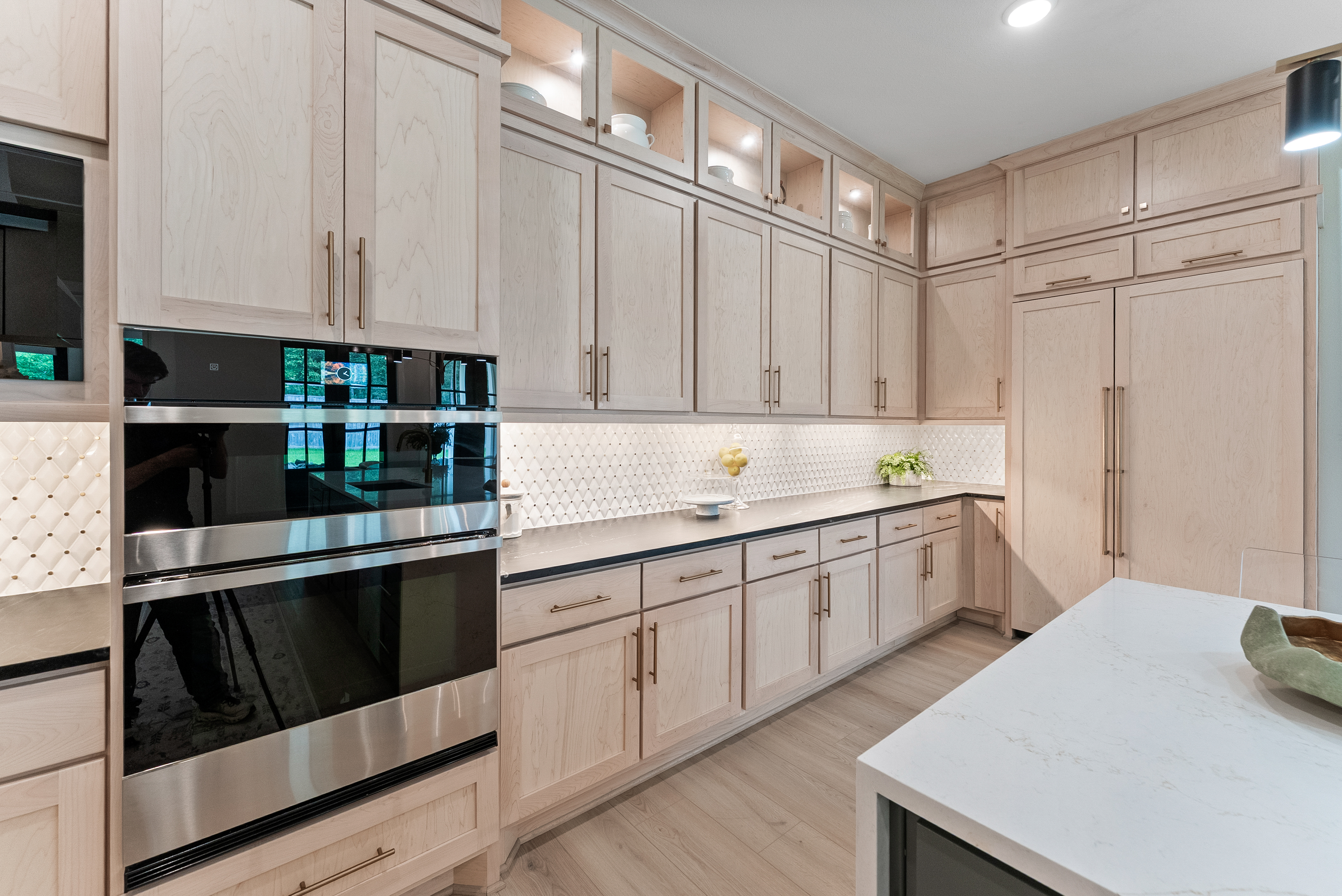 2118 Bennet Court Conroe, TX 77384 - Photo 20 of 70 a kitchen with granite countertop white cabinets and white appliances