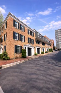 a front view of a building with many windows