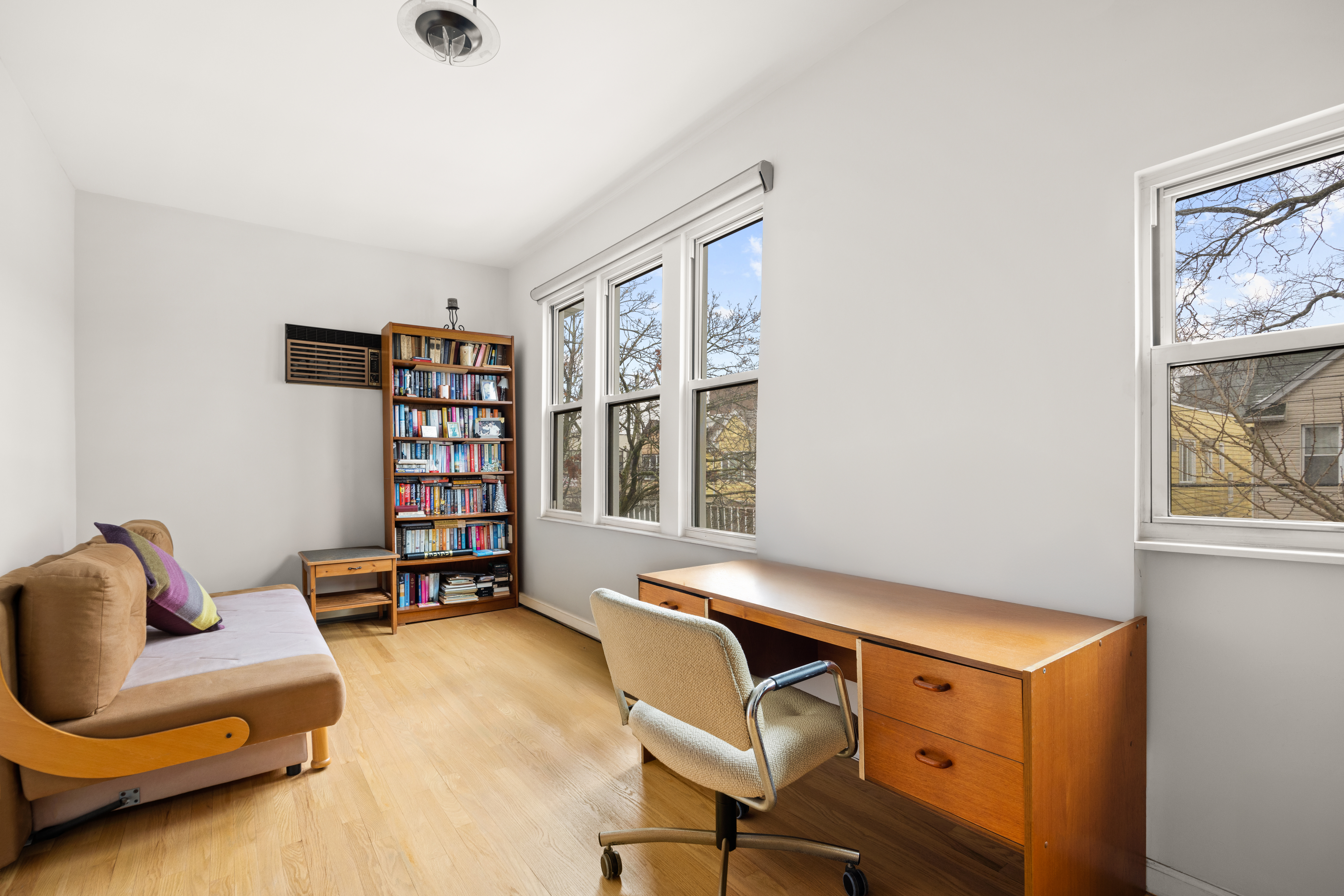 1635 West 12th Street Brooklyn, NY 11223 - Photo 10 of 21 a room with furniture and a window