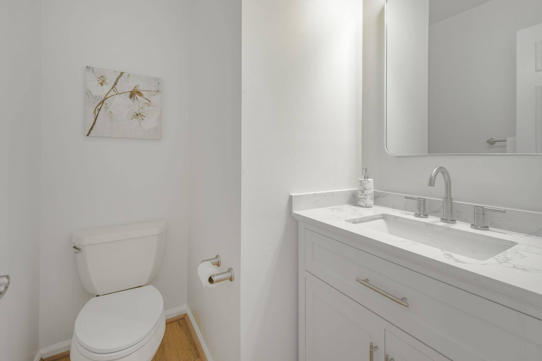 4008 Evangeline Terrace Olney, MD 20832 - Photo 25 of 54 a bathroom with a toilet sink vanity and mirror