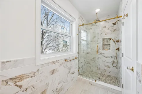 a bathroom with a shower and a bathtub