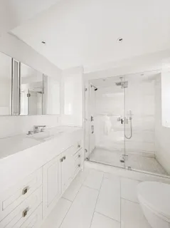a bathroom with a granite countertop sink mirror and vanity