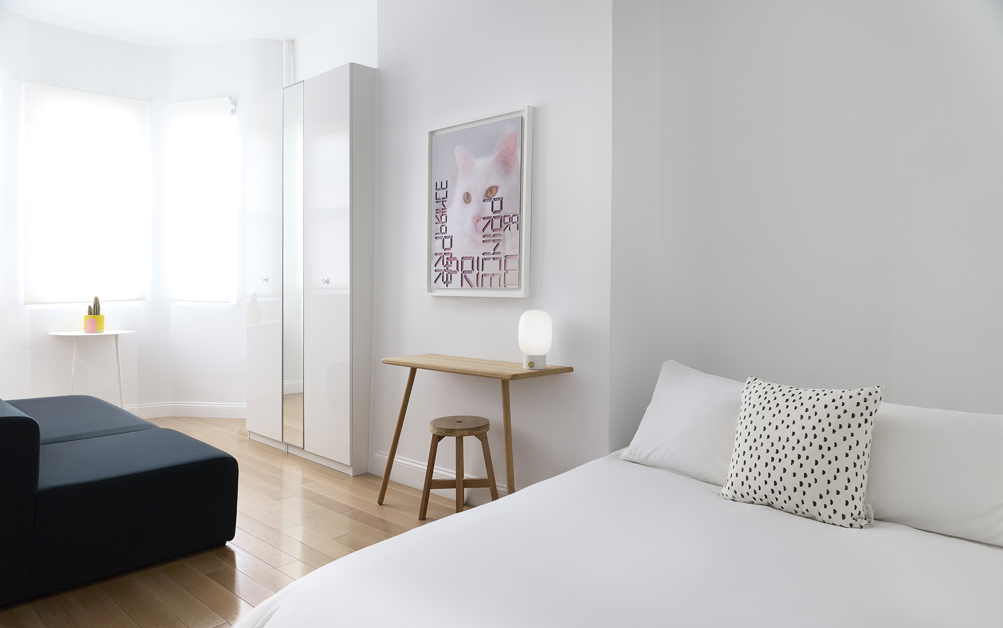 967 Lorimer Street, Unit 1 Brooklyn, NY 11222 - Photo 9 of 17 a bedroom with a bed and a couch