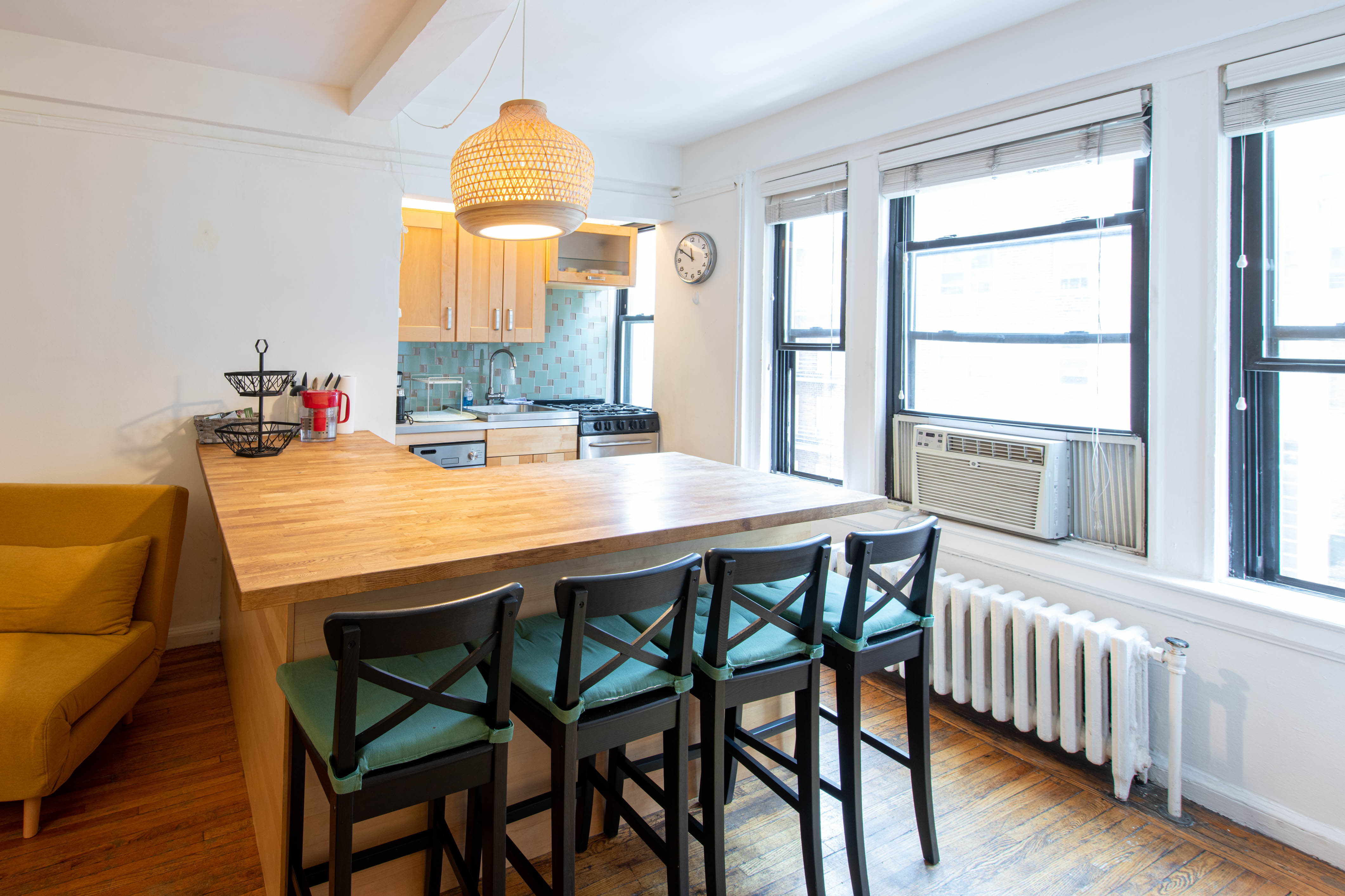 339 East 58th Street, Unit 5B Manhattan, NY 10022 - Photo 4 of 13 a dining room with furniture and window