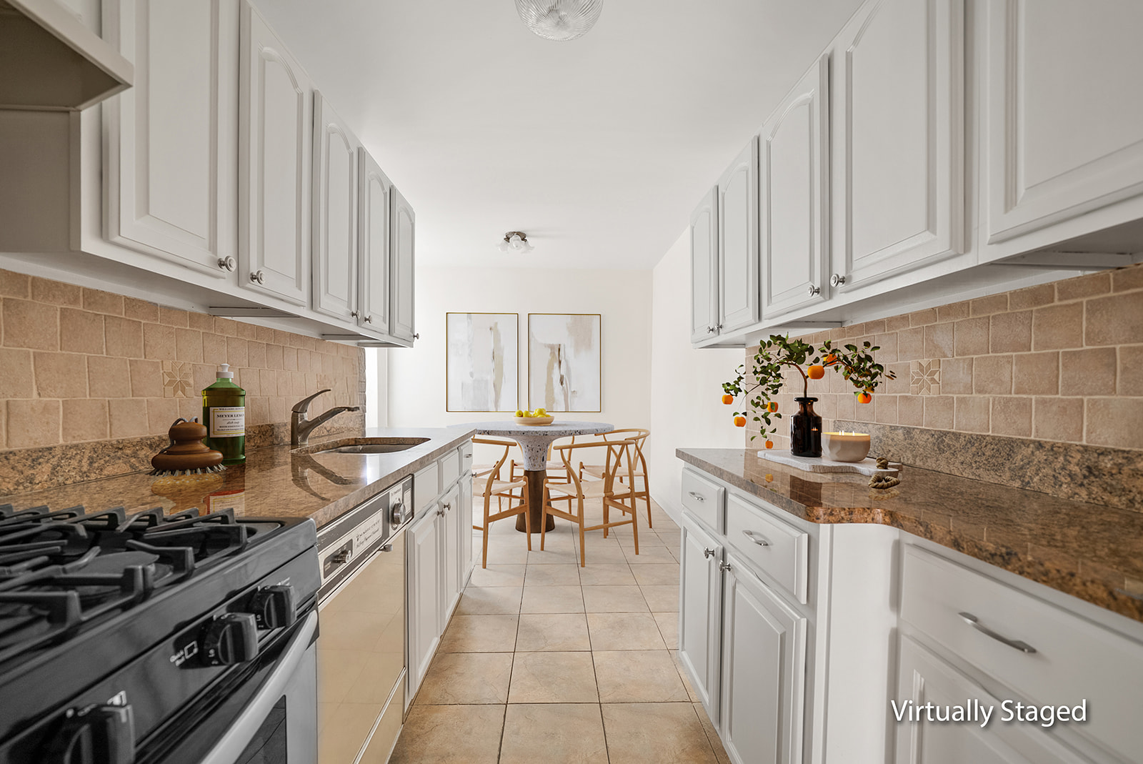 35-30 73rd Street, Unit 1F Queens, NY 11372 - Photo 5 of 10 a kitchen with stainless steel appliances granite countertop a stove a sink dishwasher and cabinets with wooden floor