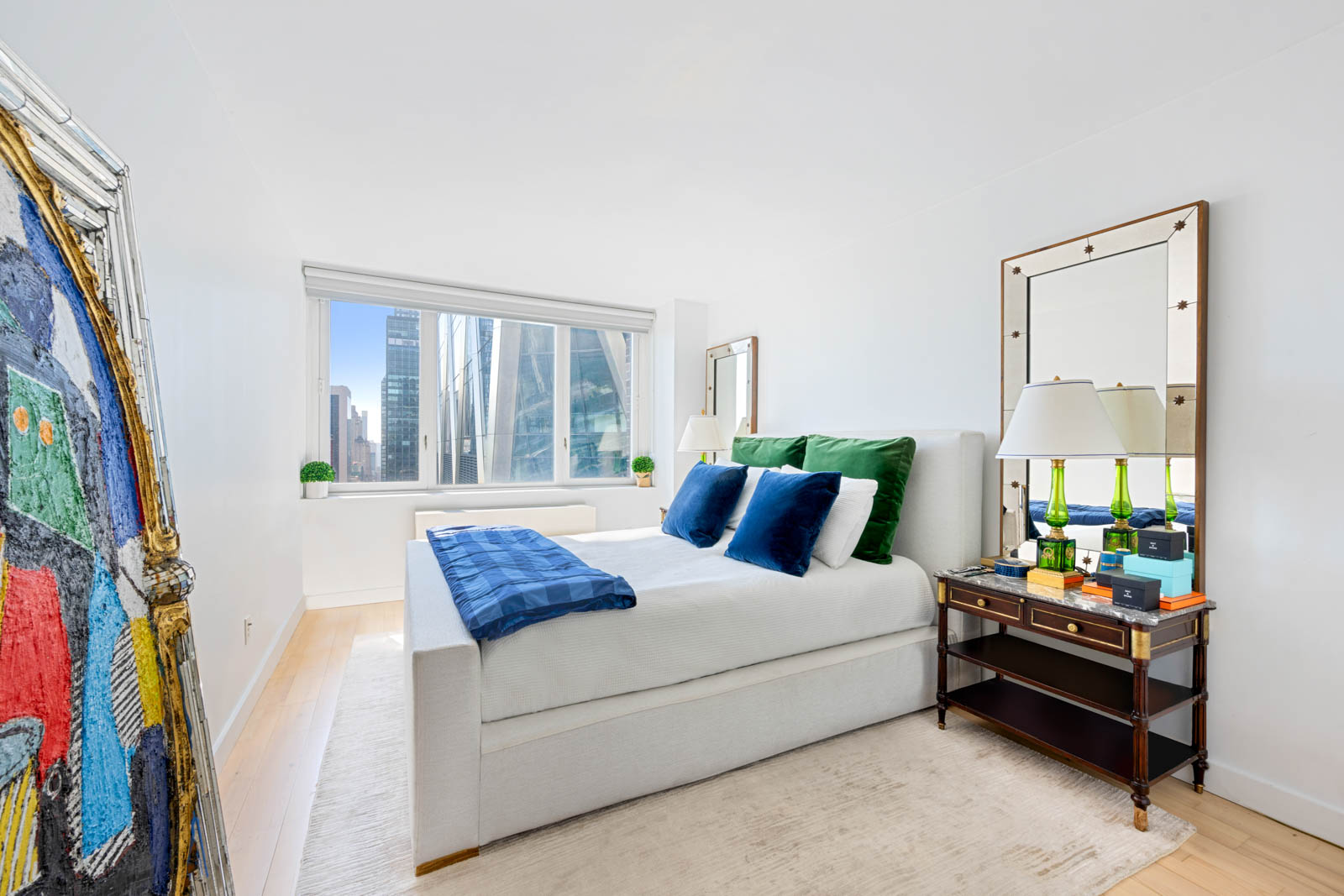 322 West 57th Street, Unit 50H Manhattan, NY 10019 - Photo 5 of 7 a bedroom with a bed and a window