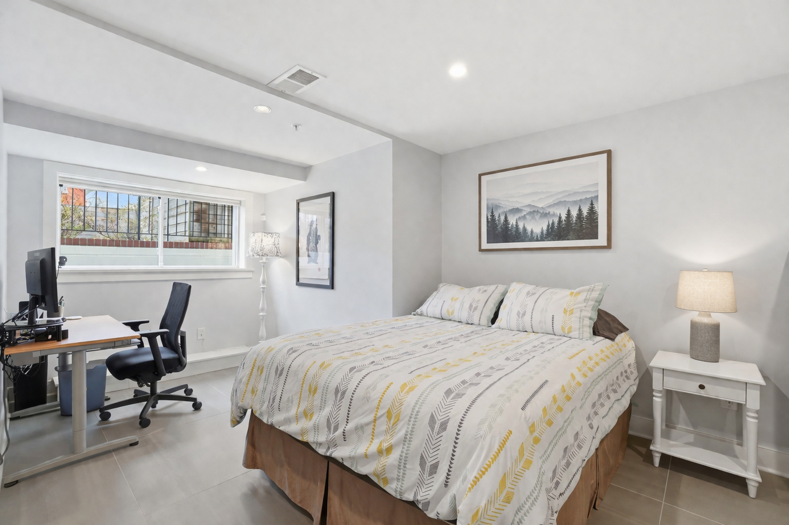 1244 Raum Street Northeast, Unit 5 Washington, DC 20002 - Photo 14 of 21 a bedroom with a bed and a desk