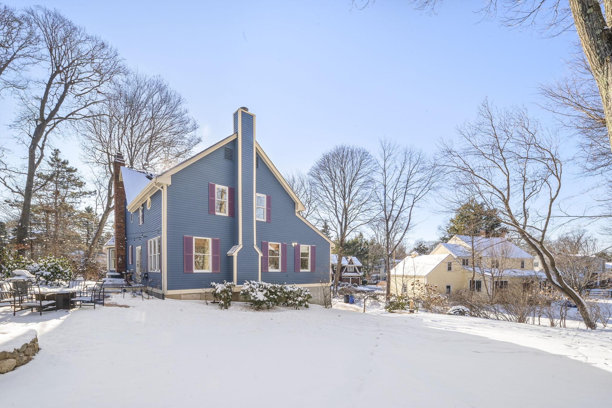 56 Jefferson Road Winchester, MA 01890 - Photo 23 of 26 a red brick house with trees in front of it