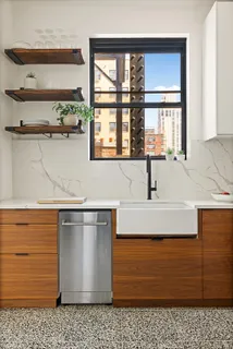 a kitchen with a sink and a window
