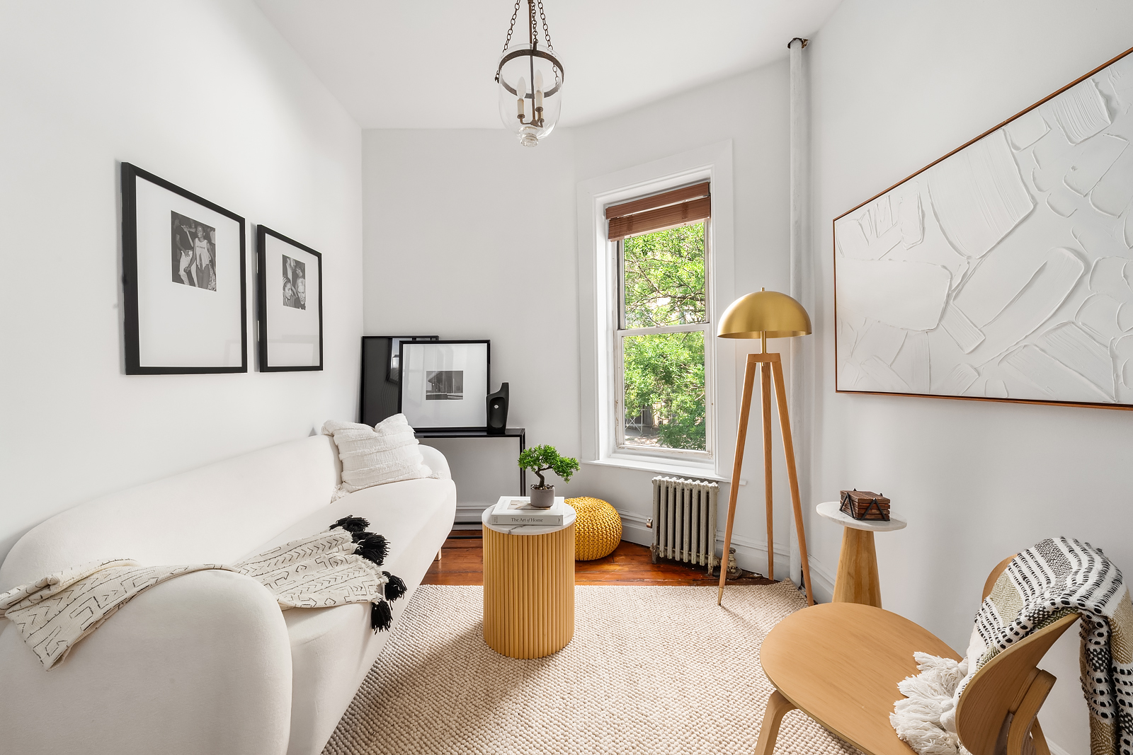 626 East 14th Street, Unit 8 Manhattan, NY 10009 - Photo 4 of 14 a living room with furniture and a window