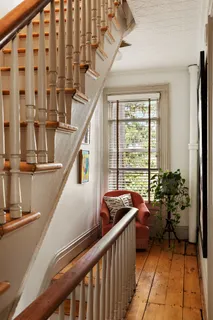 a view of entryway with a large window and livingroom view