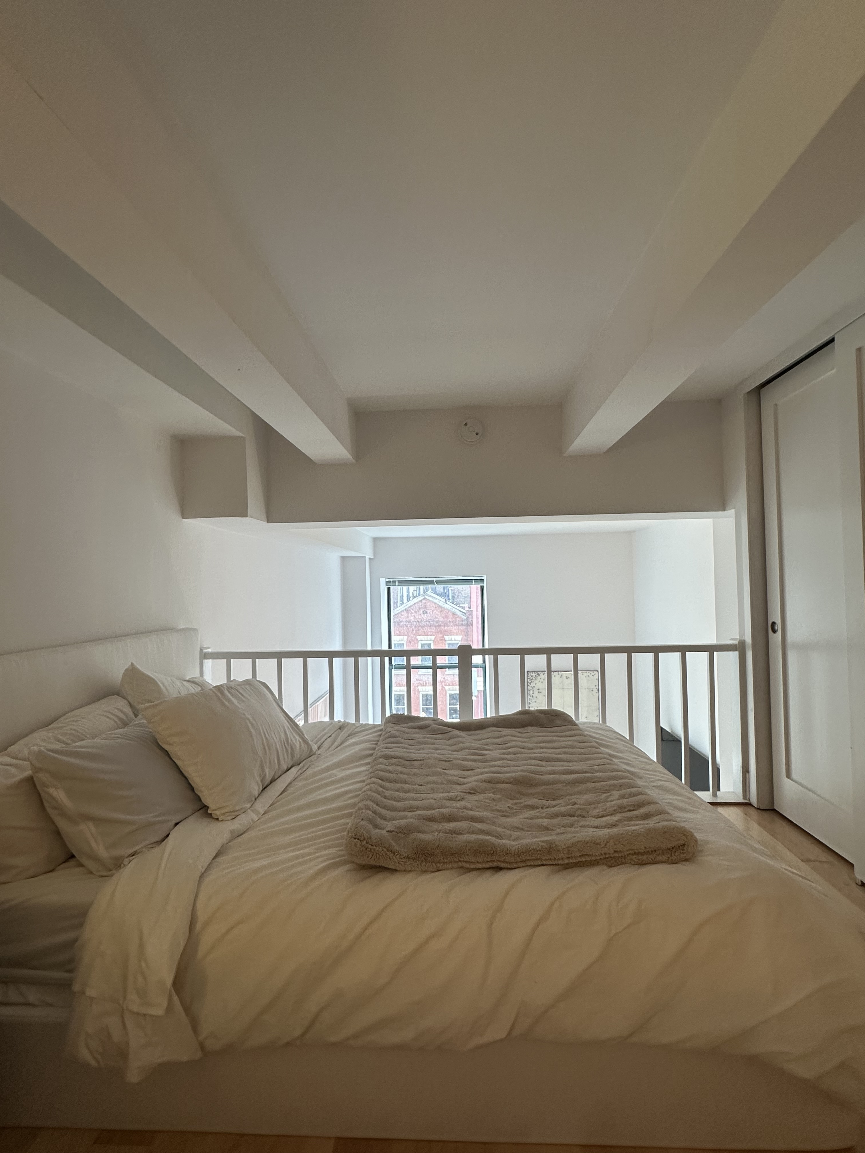 666 Greenwich Street, Unit 350 Manhattan, NY 10014 - Photo 4 of 13 a view of a bedroom with a bed