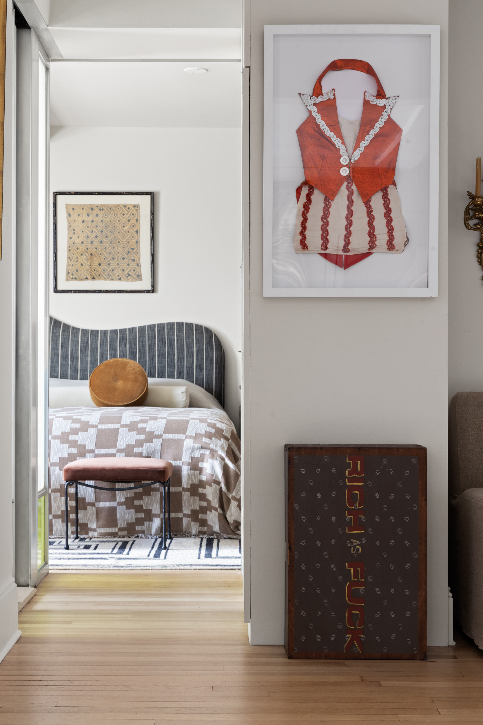 302 West 12th Street, Unit 11F Manhattan, NY 10014 - Photo 9 of 17 a room with a bed and painting on the wall