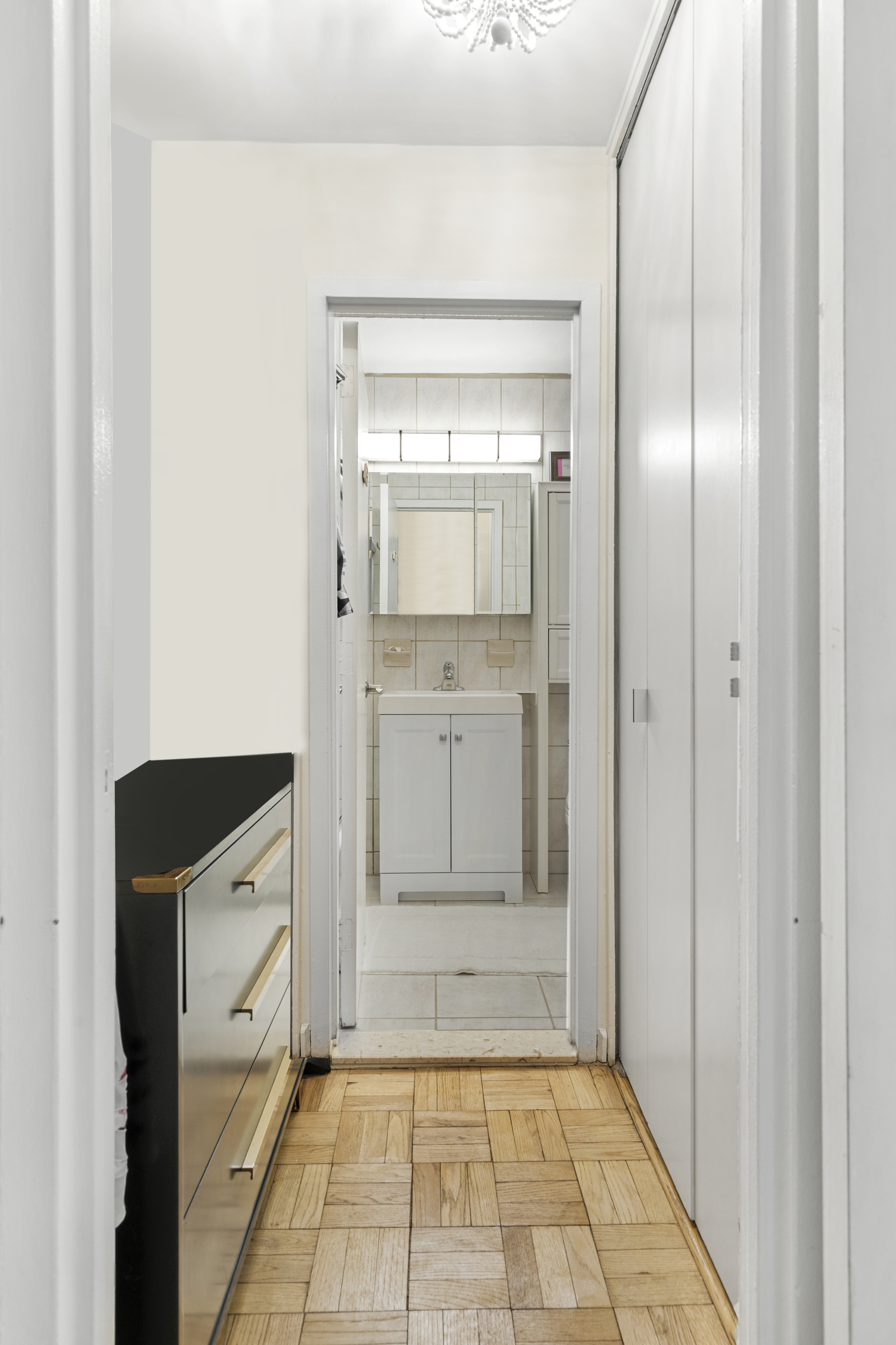 1160 3rd Avenue, Unit 15F Manhattan, NY 10065 - Photo 6 of 8 a view of a kitchen with white cabinets