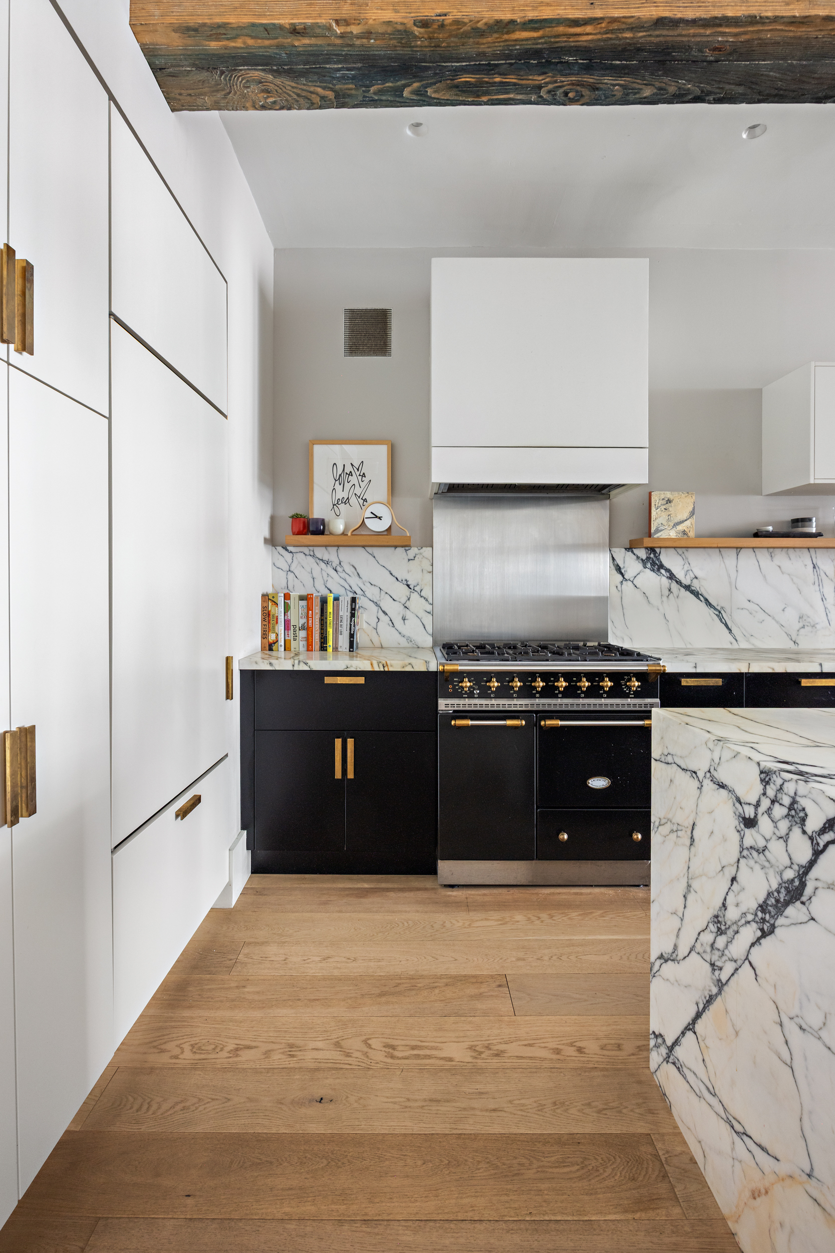 622 Greenwich Street, Unit 4B Manhattan, NY 10014 - Photo 11 of 27 a kitchen with stainless steel appliances granite countertop a stove a sink and a refrigerator