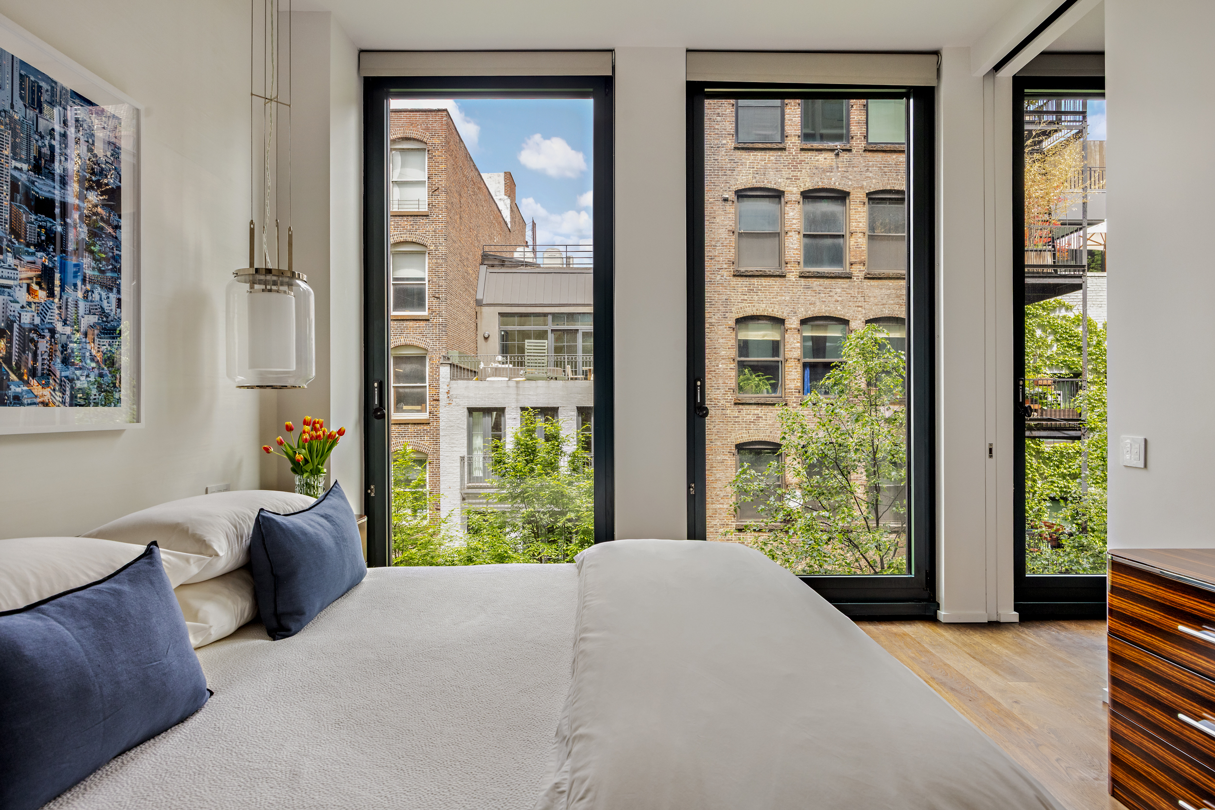 40 Bond Street, Unit 6D Manhattan, NY 10012 - Photo 14 of 23 a bed room with a bed and a window