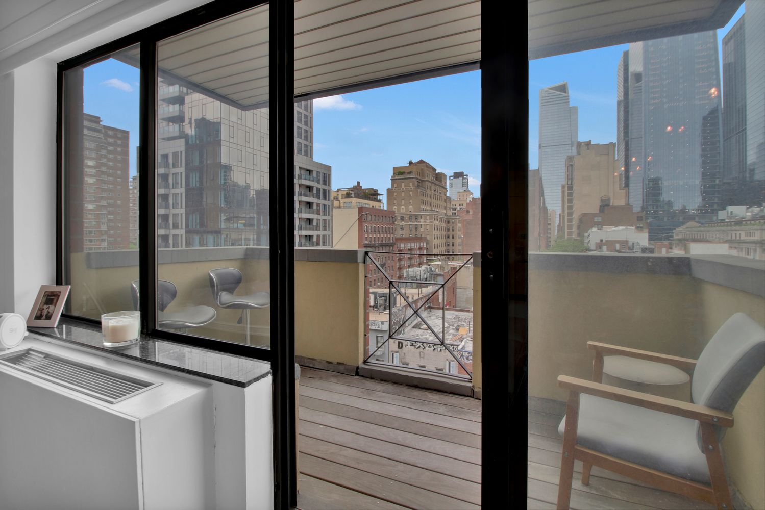 408 8th Avenue, Unit 8B Manhattan, NY 10001 - Photo 9 of 12 a view of a living room with a large window