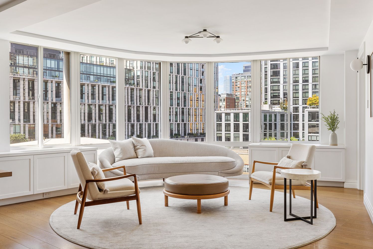 303 Greenwich Street, Unit 8DE Manhattan, NY 10013 - Photo 2 of 20 a living room with furniture and a large window