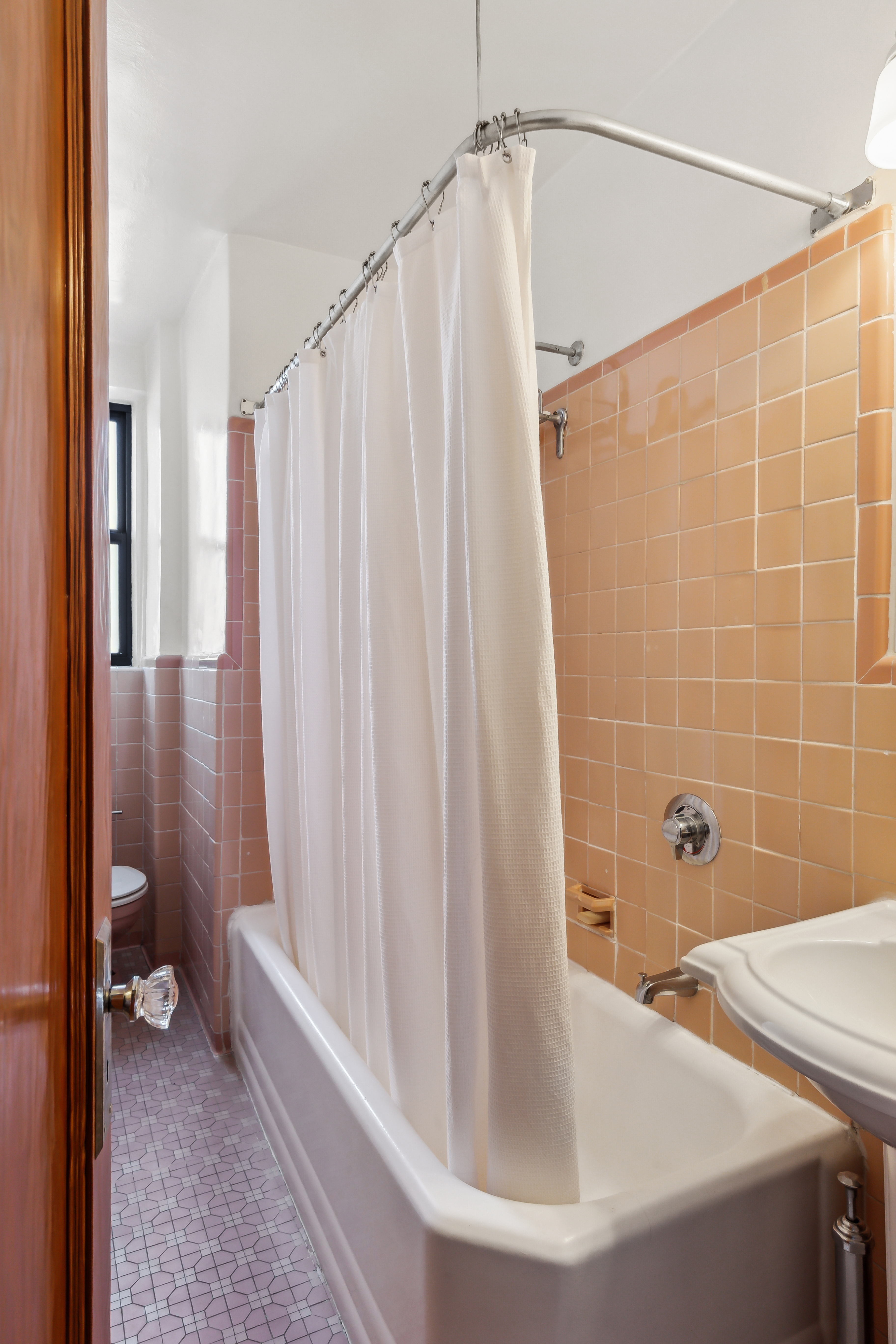 45 Park Terrace West, Unit 5A Manhattan, NY 10034 - Photo 10 of 22 a bathroom with a shower and a tub