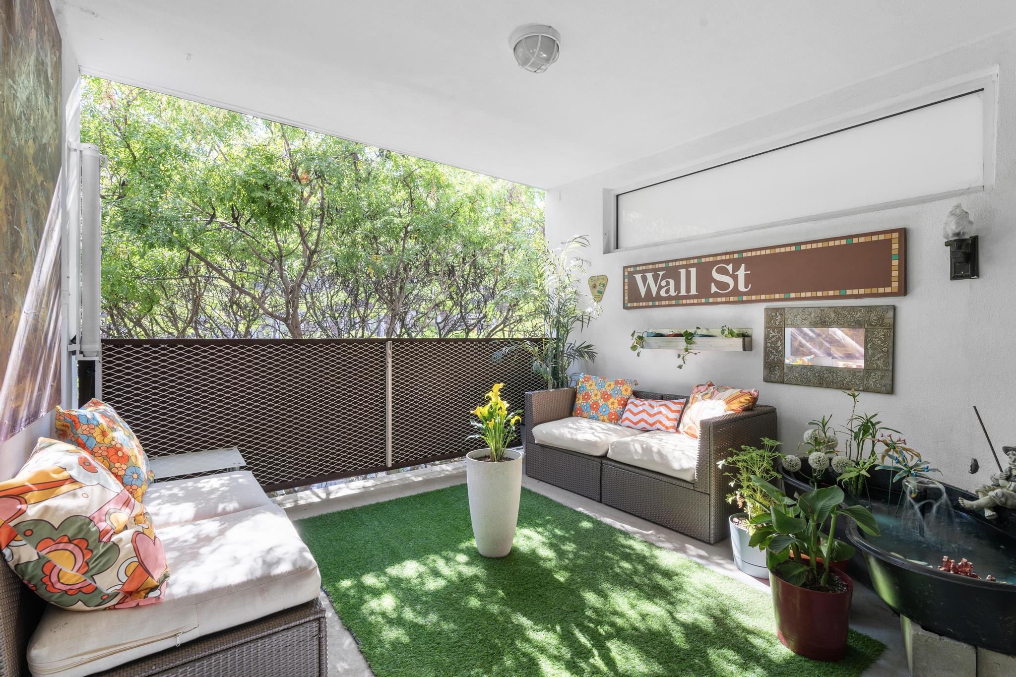 1311 Pacific Street, Unit 405 Brooklyn, NY 11216 - Photo 2 of 9 a living room with furniture