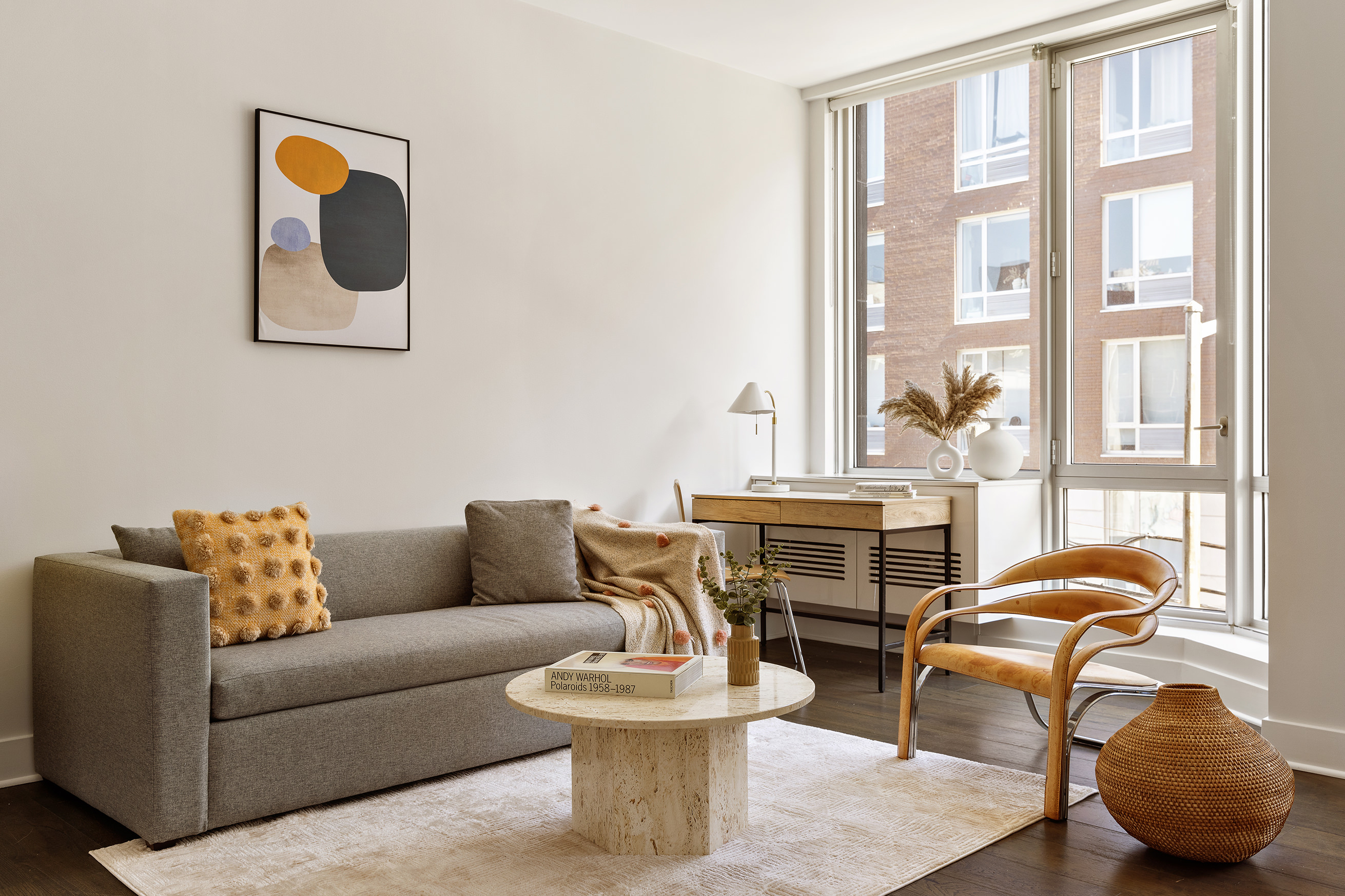 212 North 9th Street, Unit 3C Brooklyn, NY 11211 - Photo 1 of 16 a living room with furniture and a large window
