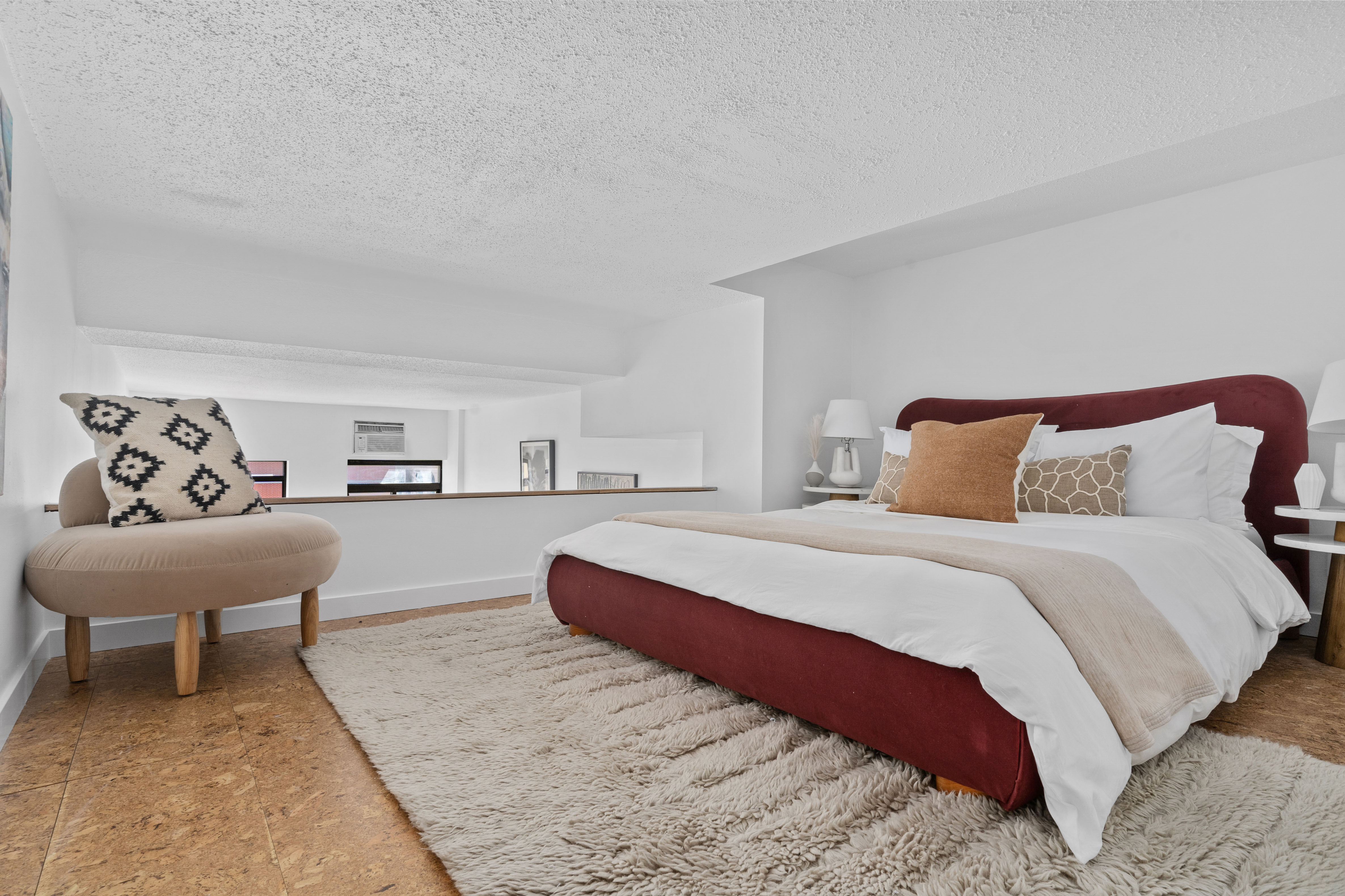 372 5th Avenue, Unit 9J Manhattan, NY 10018 - Photo 7 of 13 a bedroom with a bed and a couch