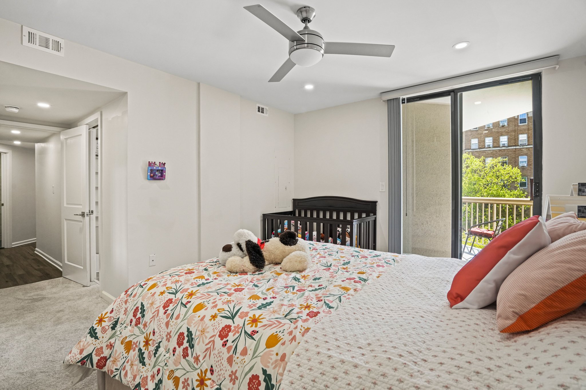 2725 Connecticut Avenue Northwest, Unit 507 Washington, DC 20008 - Photo 26 of 31 a bedroom with a bed and a large window