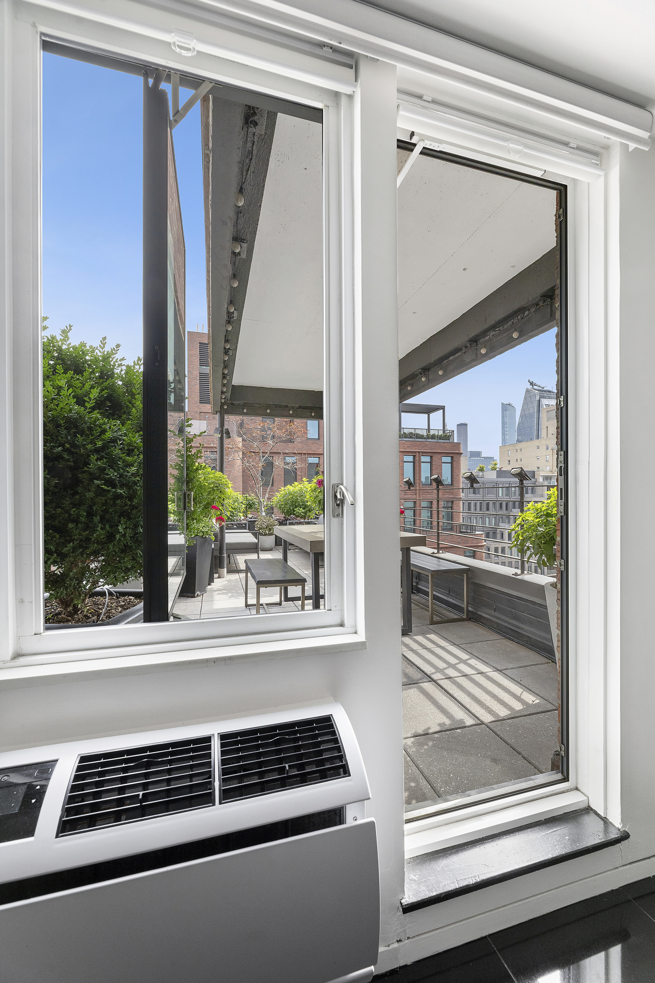105 West 13th Street, Unit 16F Manhattan, NY 10011 - Photo 6 of 12 a view of a living room and a window