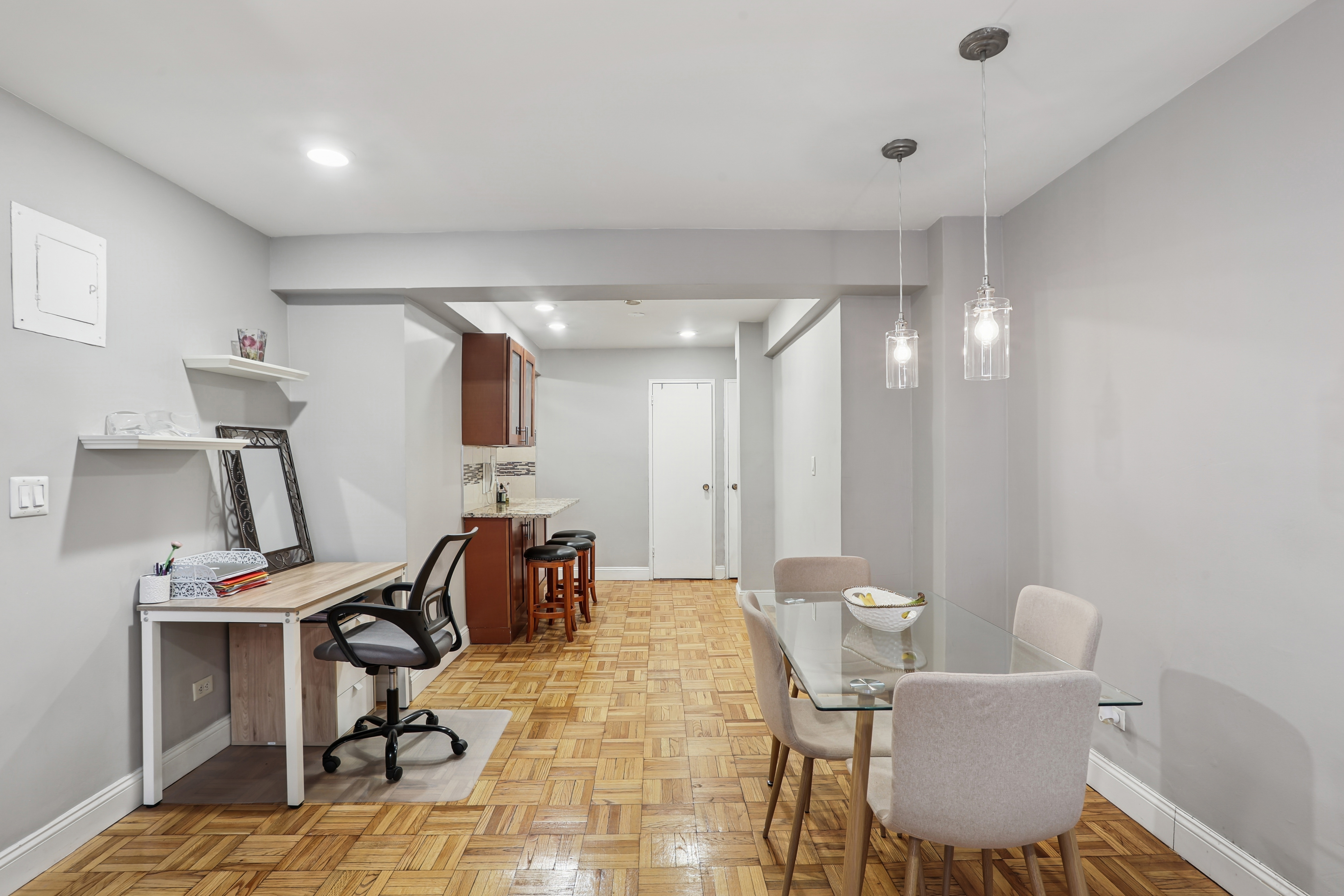 335 East 51st Street, Unit 4H Manhattan, NY 10022 - Photo 6 of 13 a view of a workspace with furniture and a window