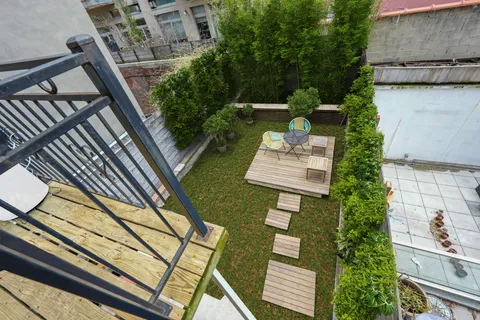 a view of a balcony with chairs