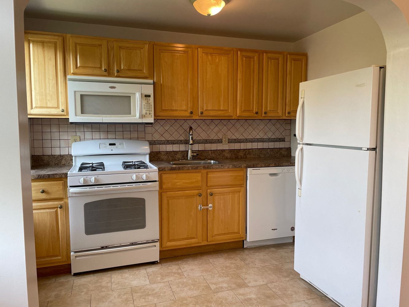 250 19th Street, Unit 3A Brooklyn, NY 11215 - Photo 8 of 15 a kitchen with a stove sink and a refrigerator