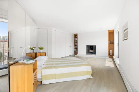 a bedroom with a bed and a walk in closet