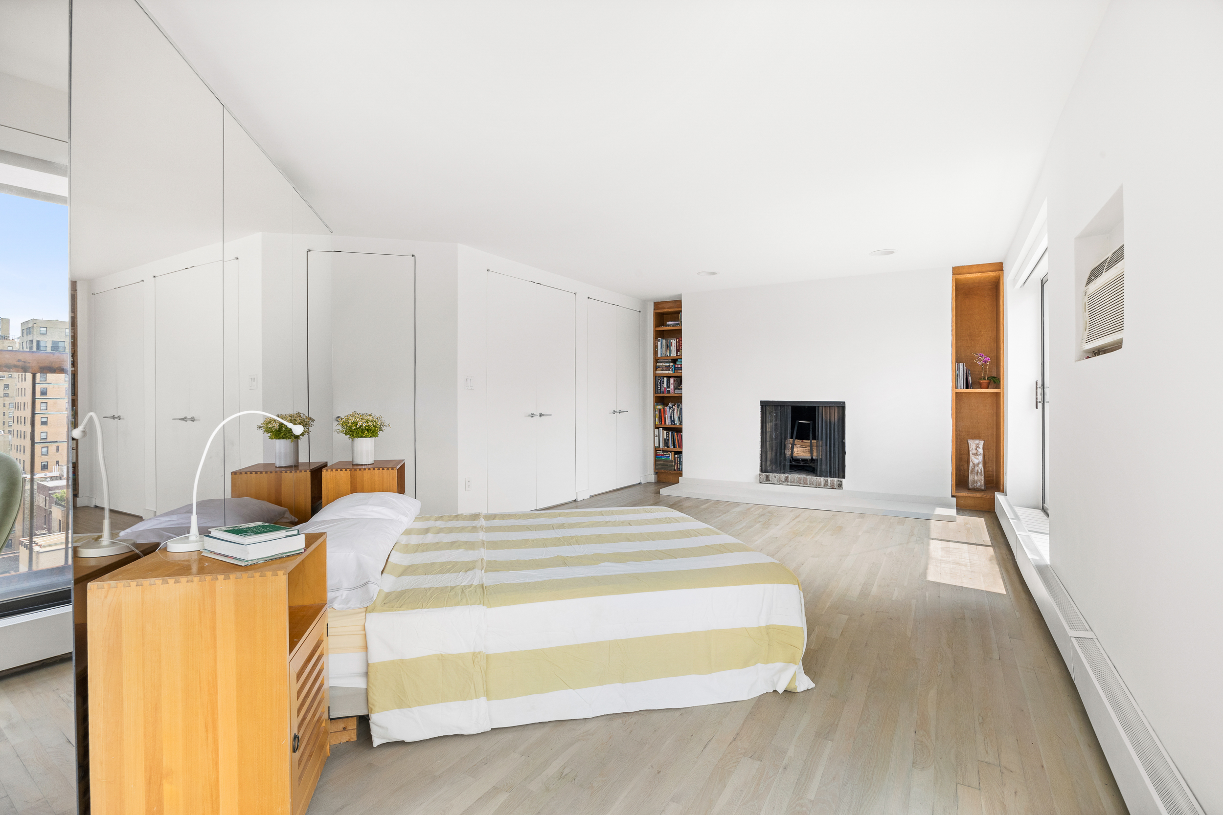 330 West End Avenue, Unit PHB Manhattan, NY 10023 - Photo 9 of 20 a bedroom with a bed and a walk in closet