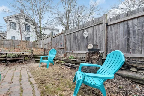 a view of backyard with a table and chairs