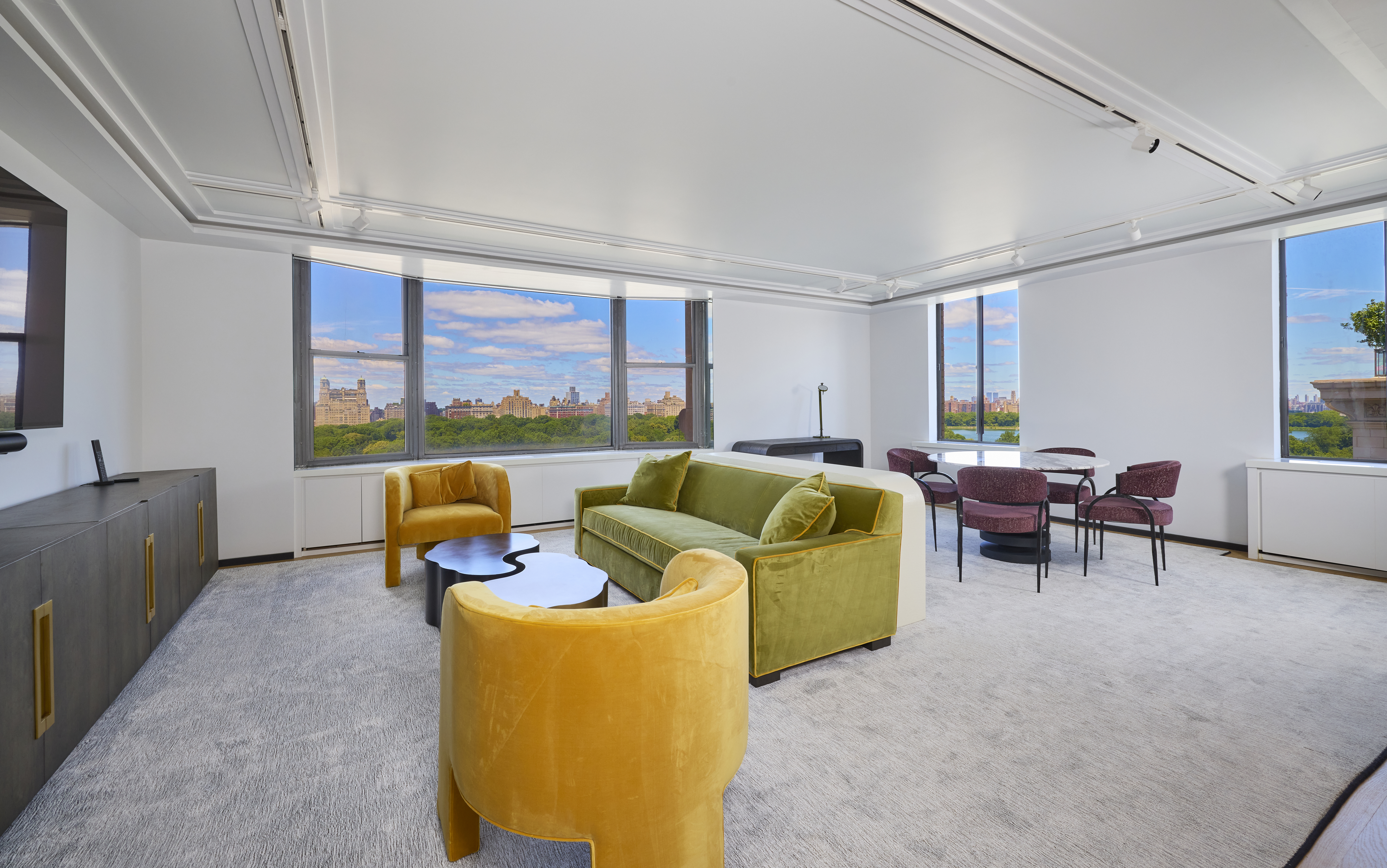 1001 5th Avenue, Unit 18A Manhattan, NY 10028 - Photo 3 of 13 a living room with furniture and a large window