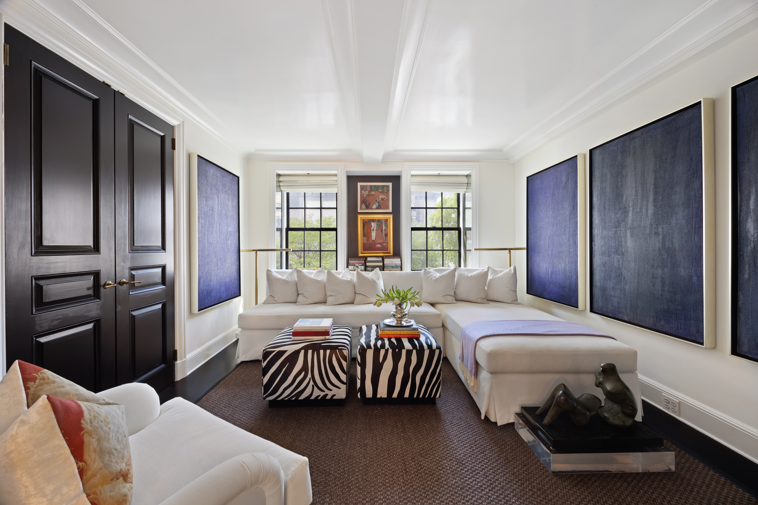 170 East 78th Street, Unit 8E Manhattan, NY 10075 - Photo 7 of 16 a bedroom with a bed couch and a window