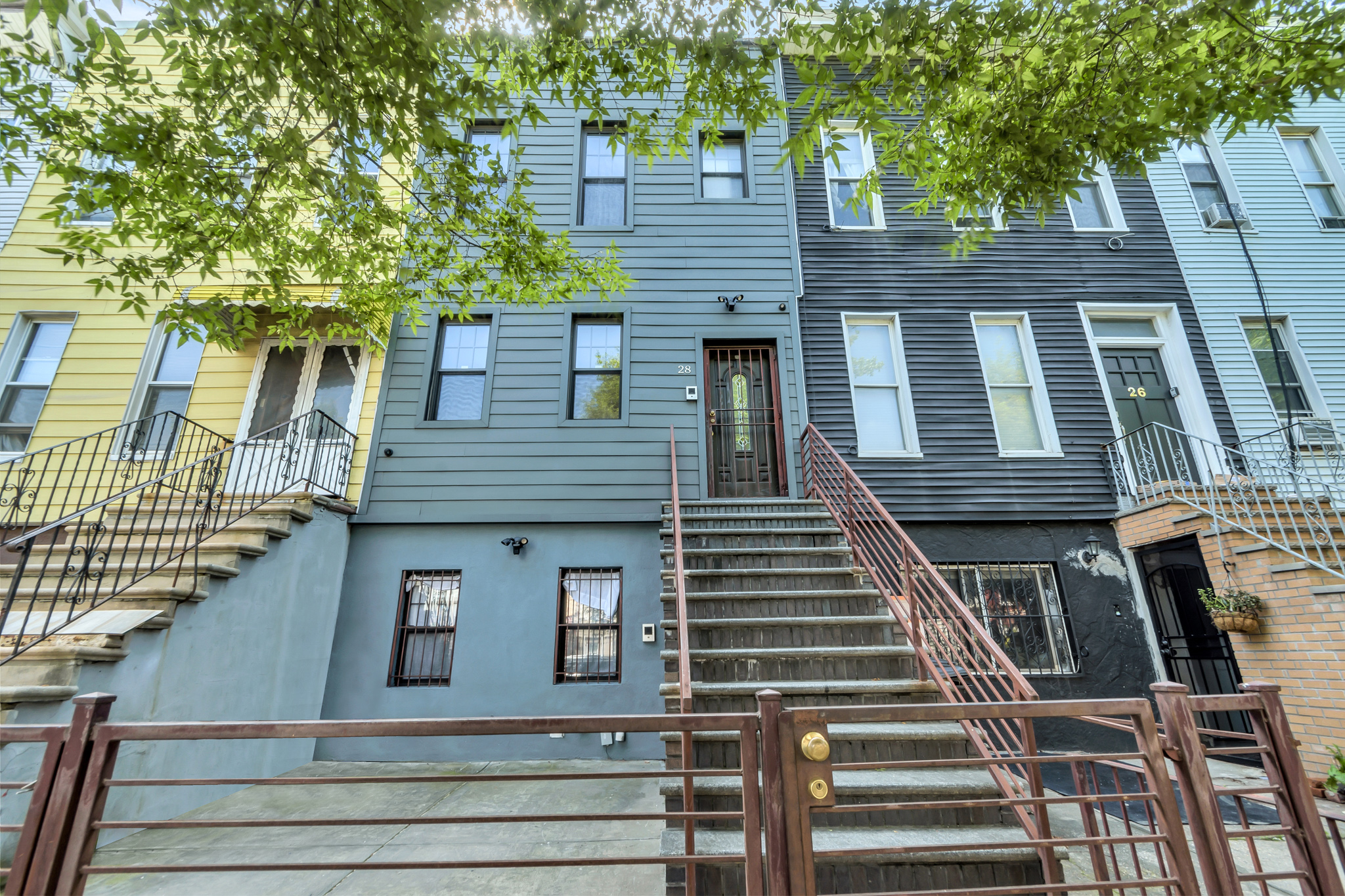 28 Roosevelt Place, Unit 2 Brooklyn, NY 11233 - Photo 11 of 12 a view of a house with more windows and brick walls