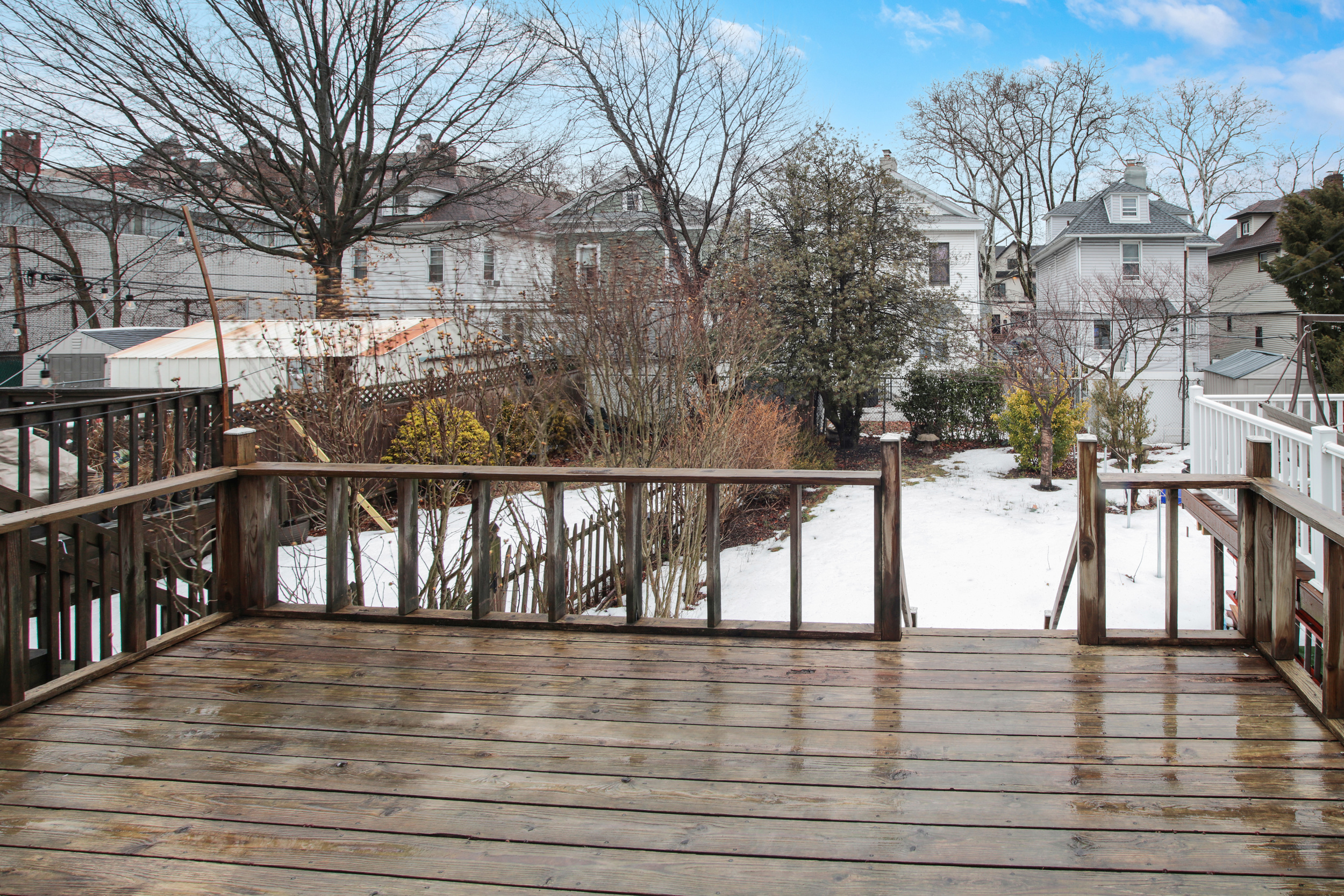425 81st Street Brooklyn, NY 11209 - Photo 13 of 13 a view of wooden street with a bench on roof