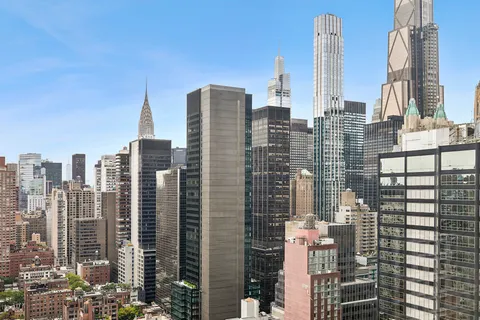 a view of city with tall buildings