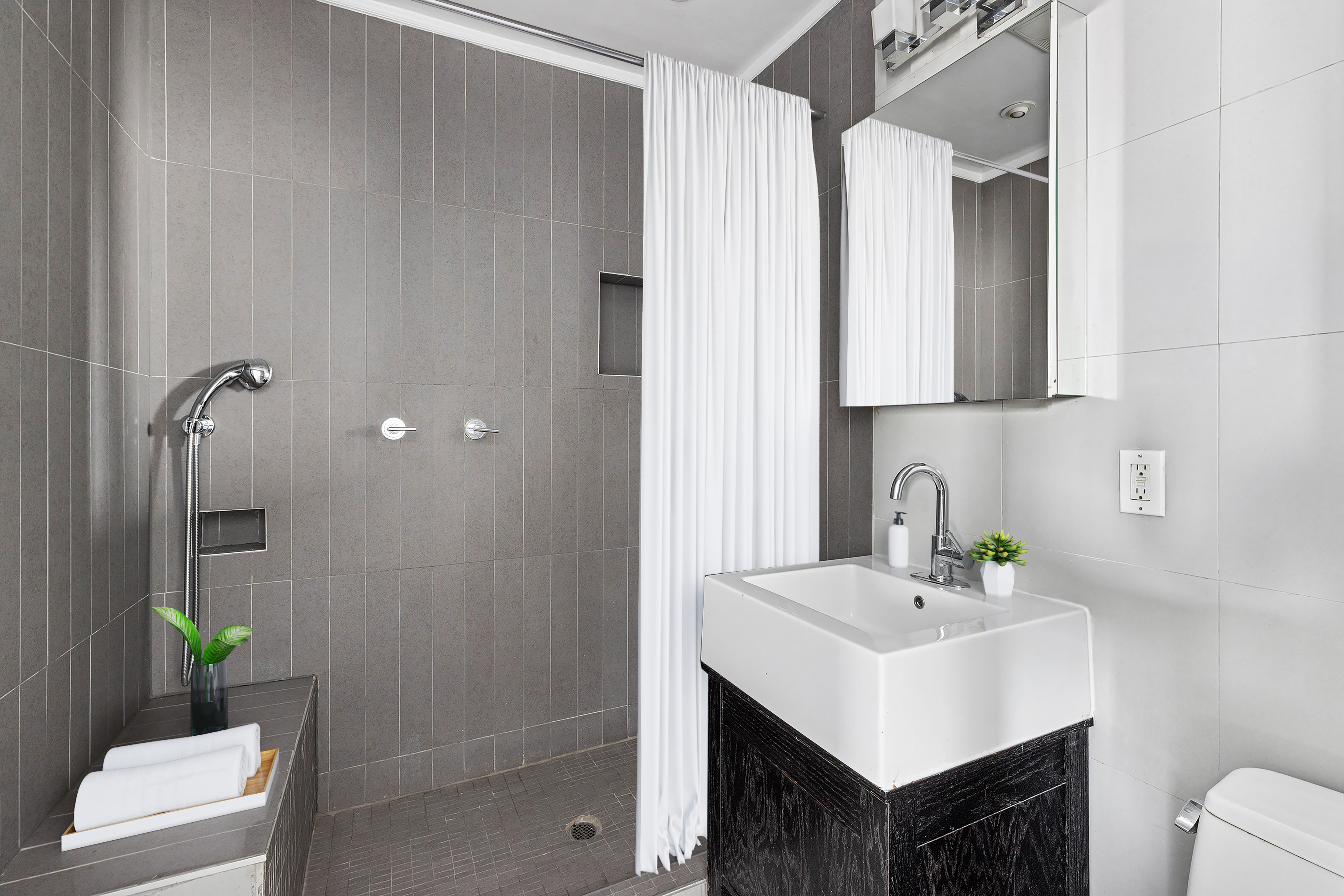 242 South 1st Street, Unit 4E Brooklyn, NY 11211 - Photo 13 of 15 a bathroom with a sink toilet and shower