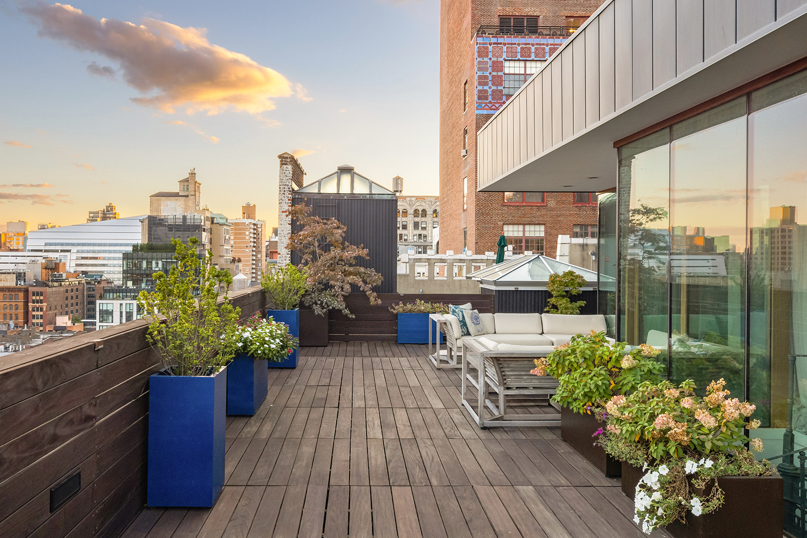 105 East 29th Street, Unit 12PH Manhattan, NY 10016 - Photo 15 of 24 a view of a balcony with chairs potted plants