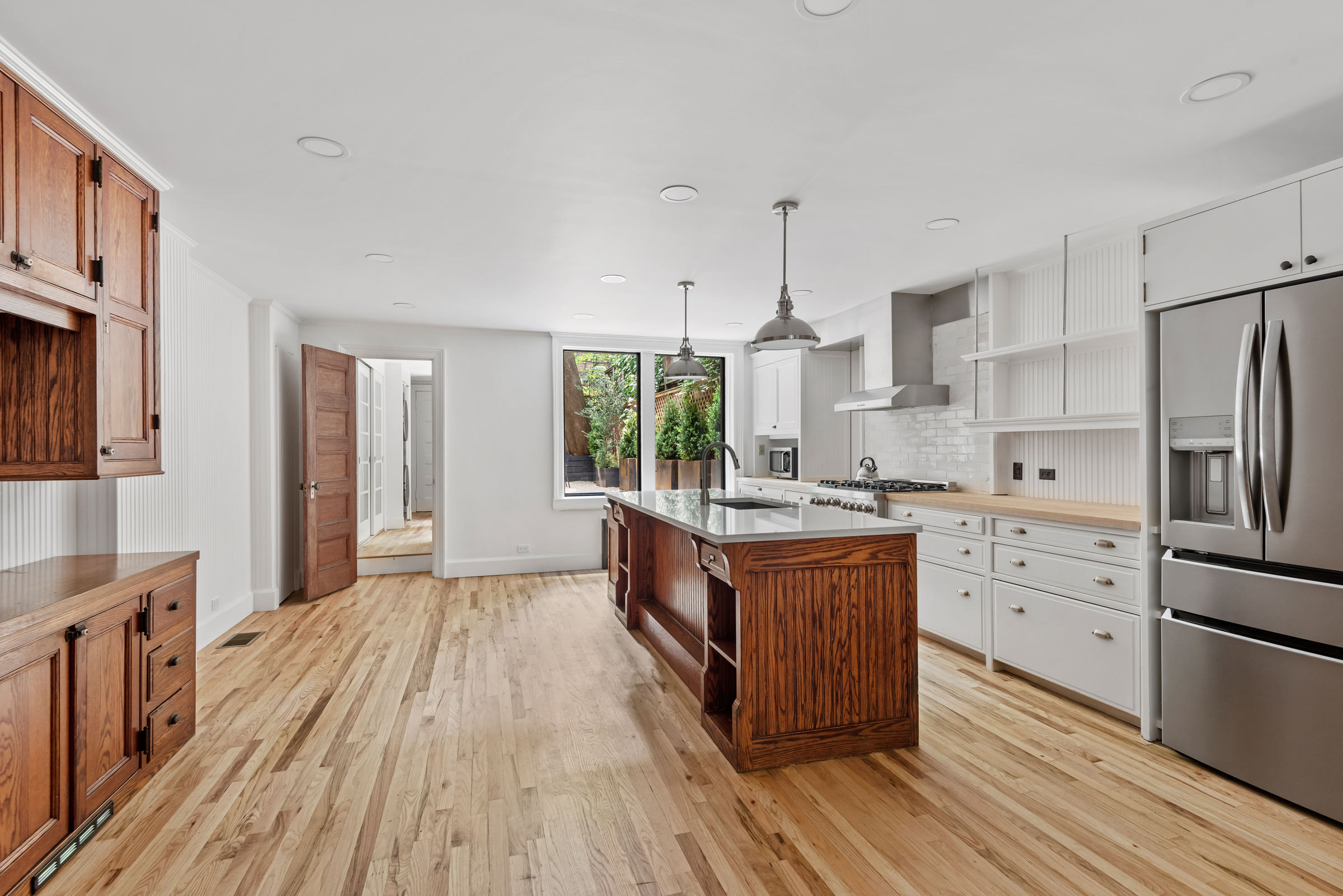 616 2nd Street Brooklyn, NY 11215 - Photo 4 of 19 a kitchen with stainless steel appliances kitchen island granite countertop a stove a sink and a refrigerator