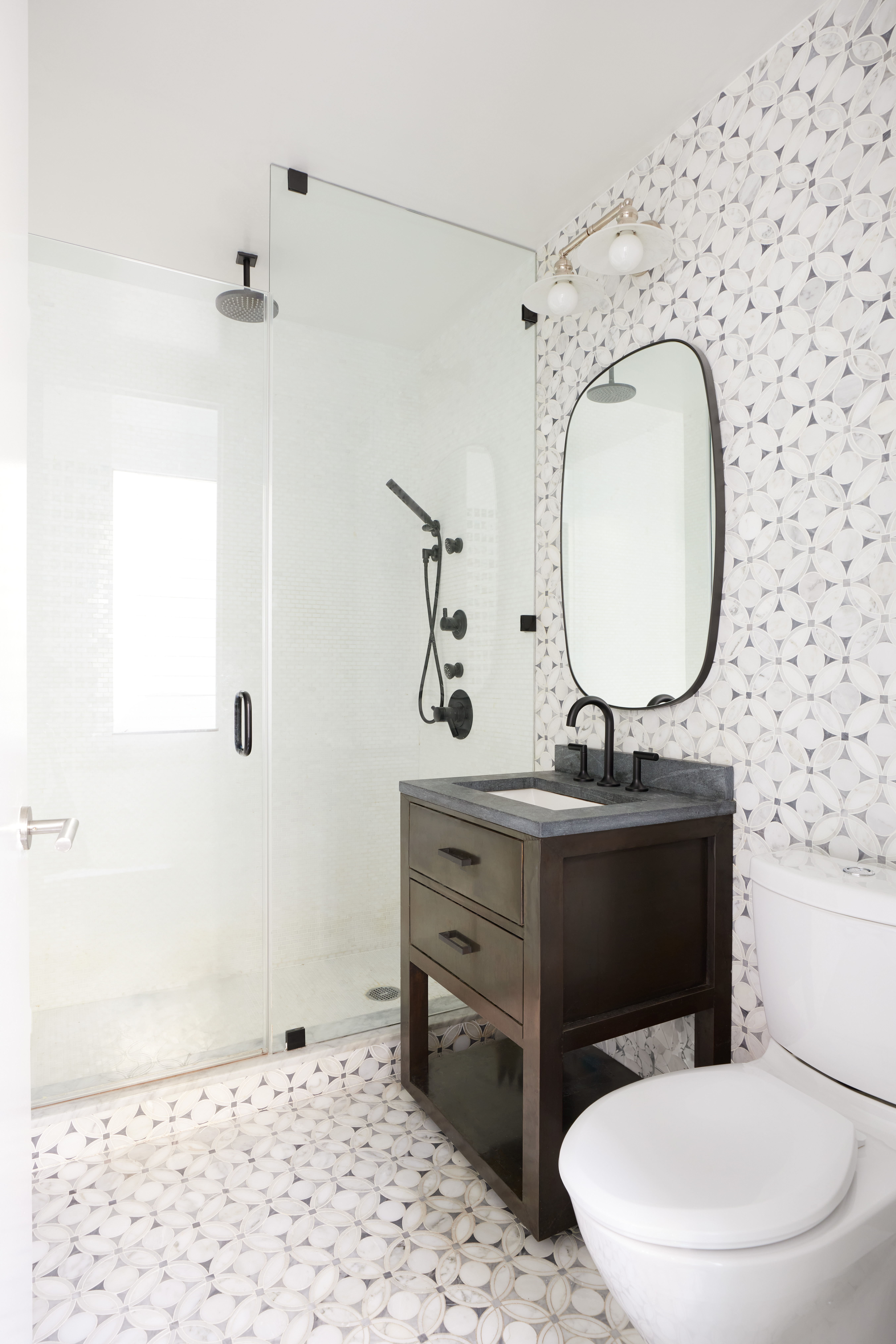 505 Greenwich Street, Unit 14A Manhattan, NY 10013 - Photo 15 of 20 a bathroom with a toilet a sink and mirror