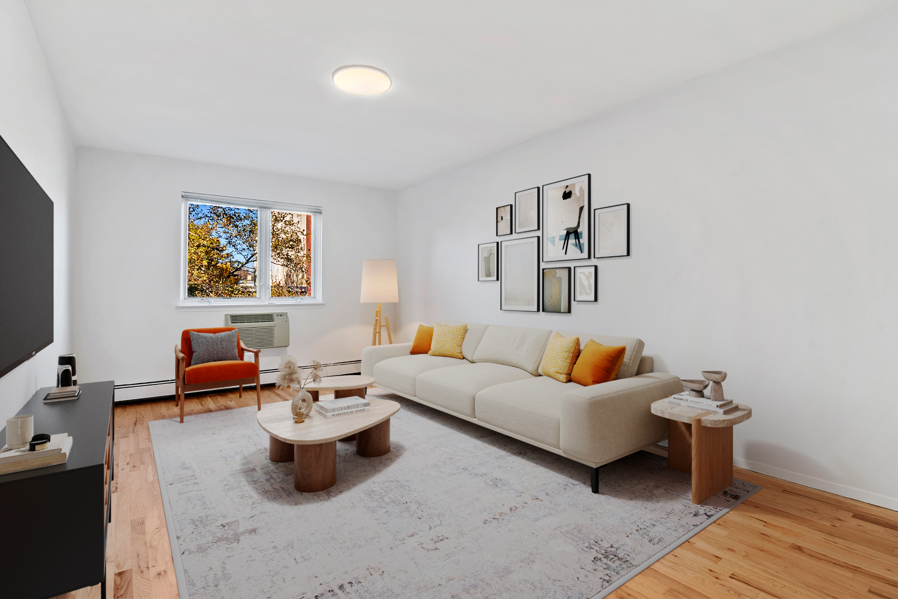 a living room with furniture and a flat screen tv