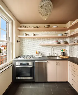a kitchen with a stove and cabinets