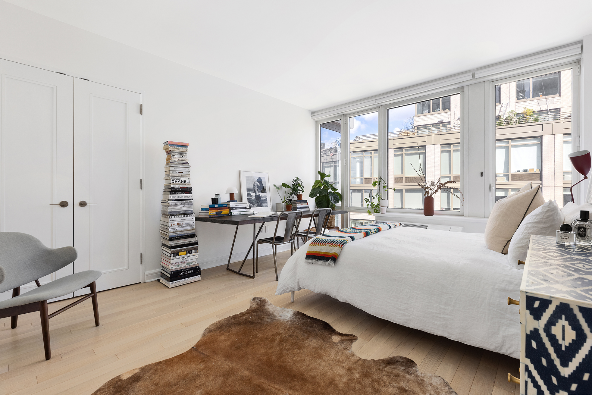 80 Riverside Boulevard, Unit 12D Manhattan, NY 10069 - Photo 7 of 16 a living room with furniture and a large window