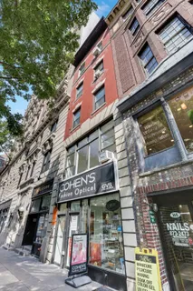 a view of a building with retail shops