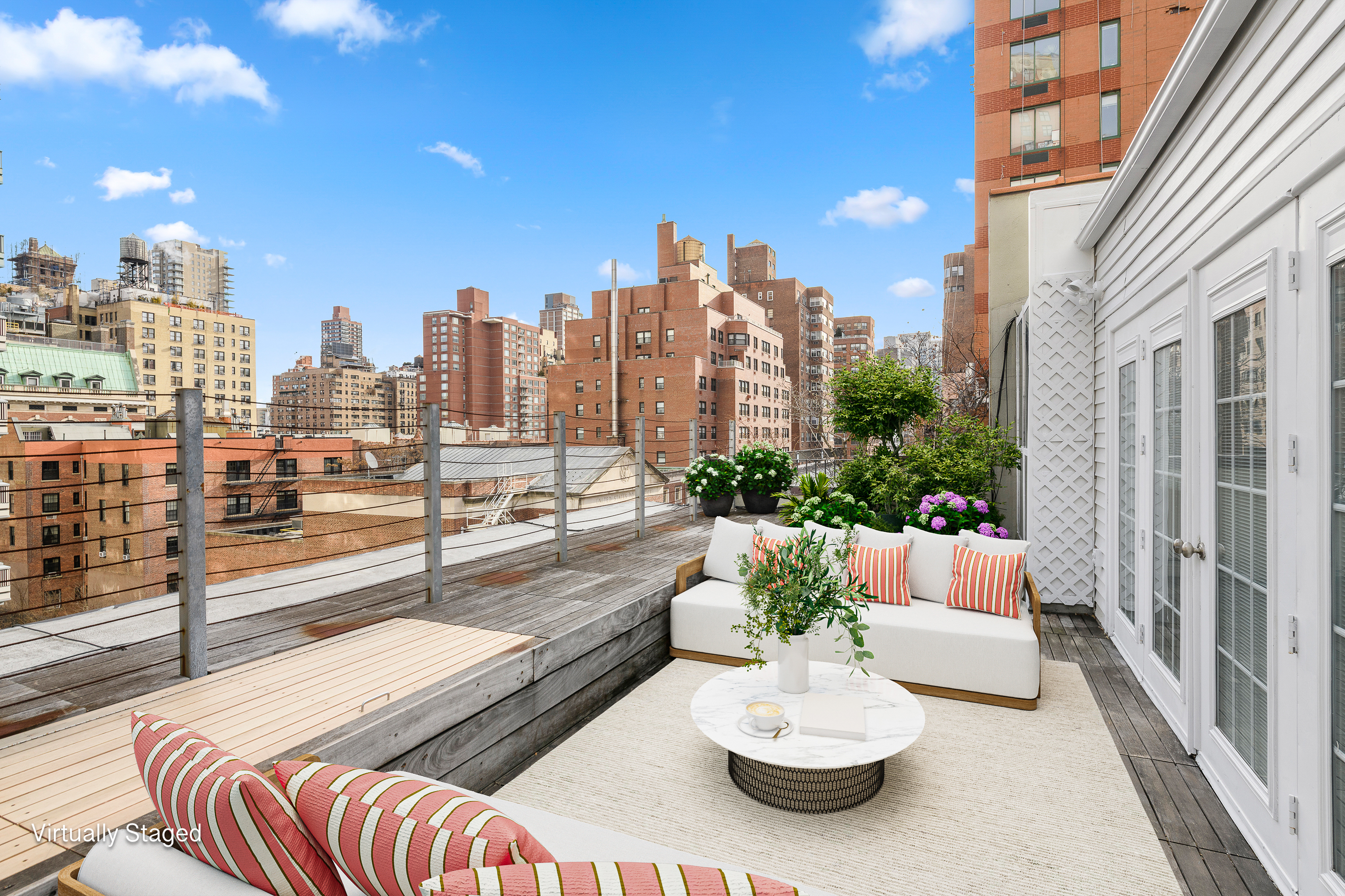 212 East 70th Street, Unit 4B Manhattan, NY 10021 - Photo 2 of 16 a view of a terrace with furniture and a potted plant