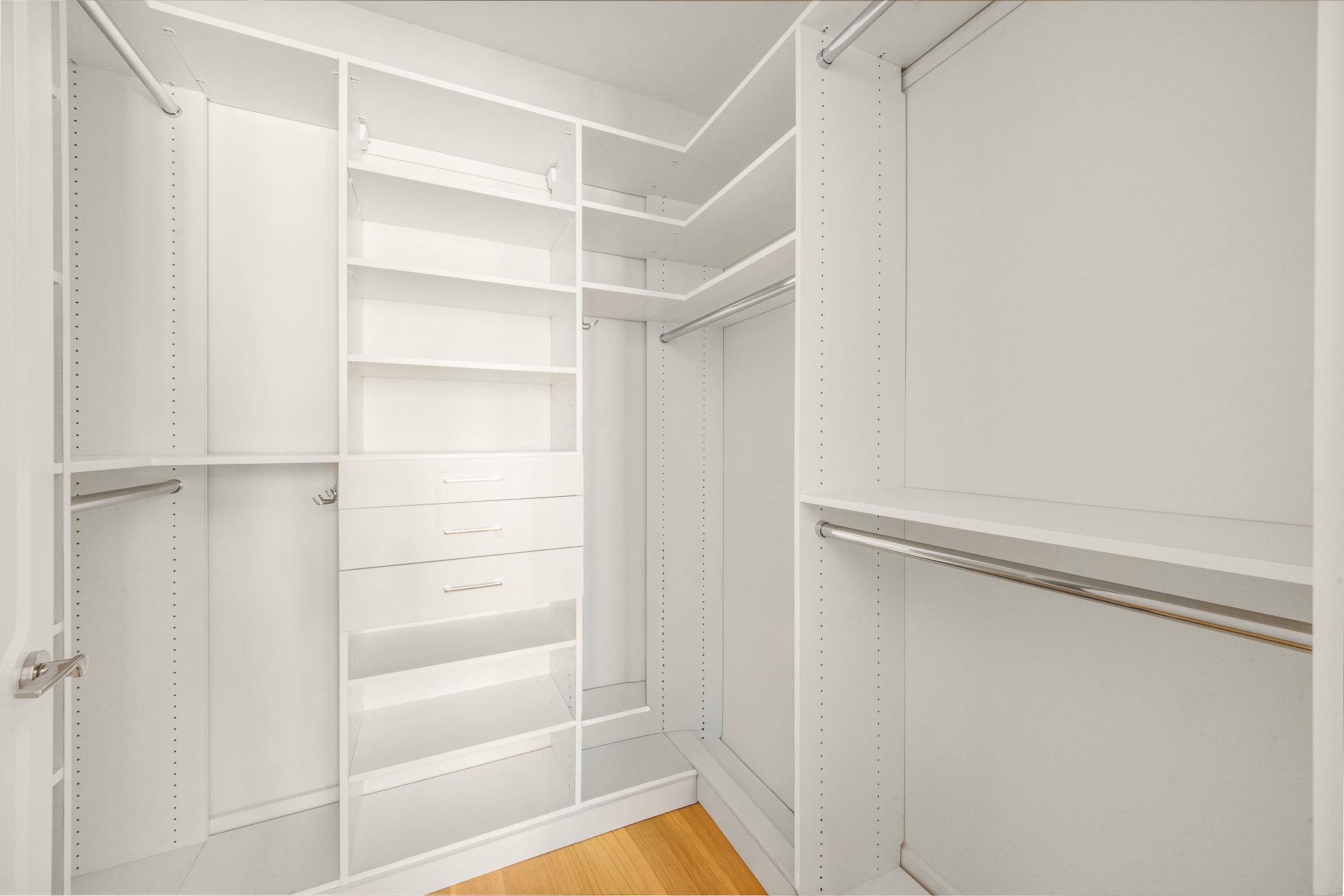 110 Charlton Street, Unit 17E Manhattan, NY 10014 - Photo 14 of 20 a view of walk in closet with empty racks