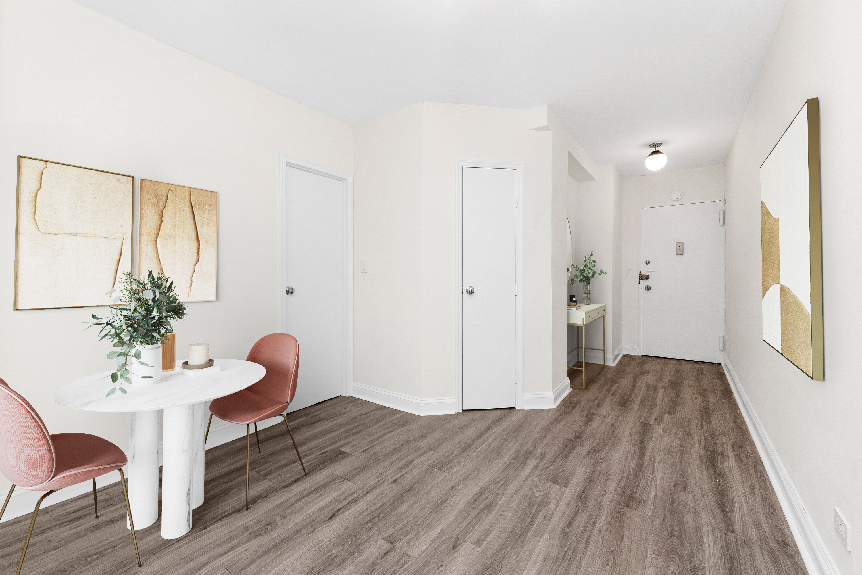 a view of a livingroom with furniture and wooden floor